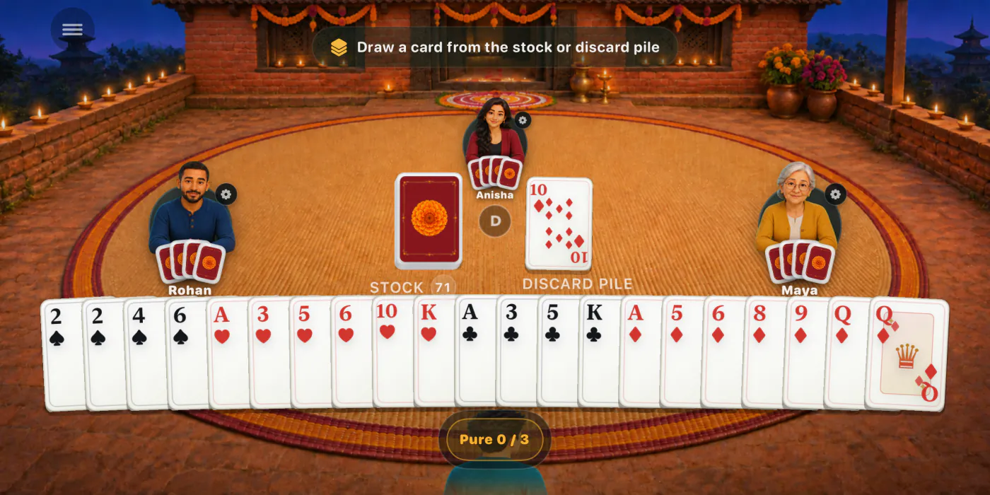 A four-player Marriage table in a courtyard lit with oil lamps for Tihar, with my twenty-one cards along the bottom.